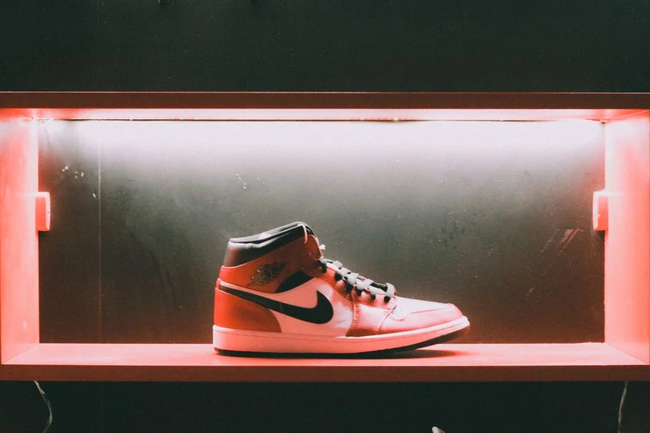 A sleek Air Jordan sneaker showcased with vibrant lighting in Muscat, Oman.