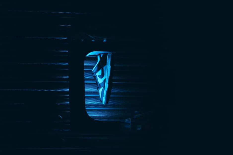 A blue sneaker creatively lit against a dark backdrop, capturing a modern and bold fashion statement.