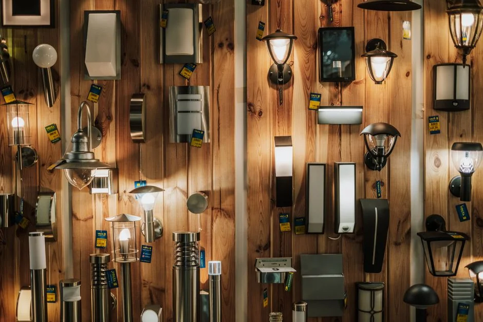 A vibrant display of various wall lamps in a lighting store in Gostyń, Poland.