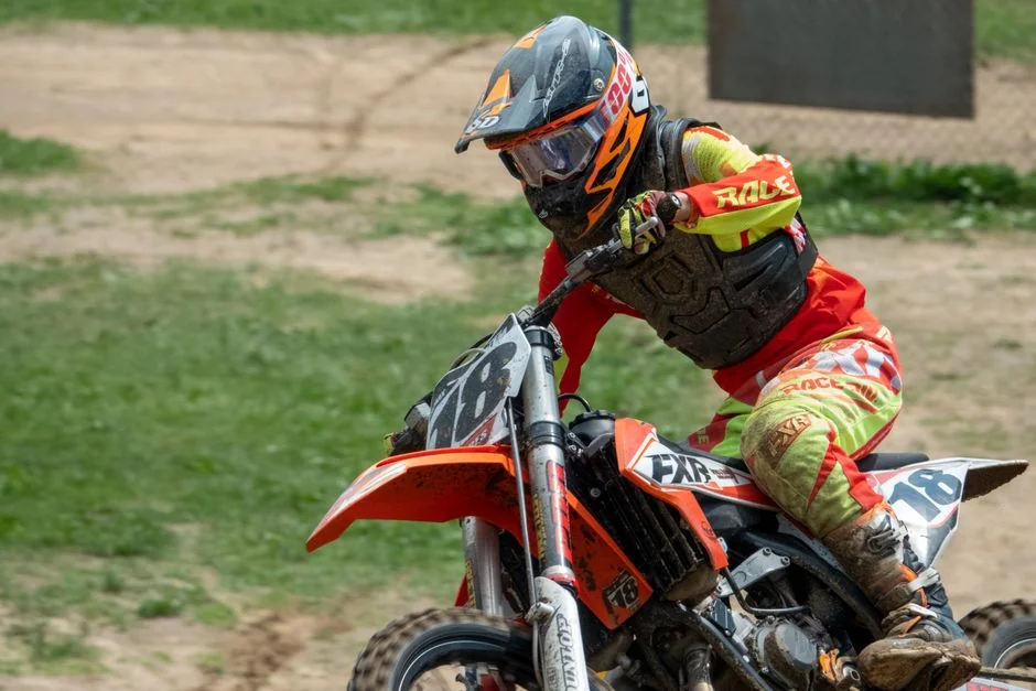 Dynamic action shot of a motocross rider in full gear racing in Millville, MN.